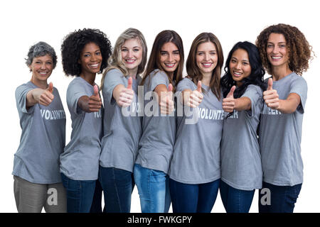 Portrait de professionnels bénévoles montrant leur Thumbs up Banque D'Images