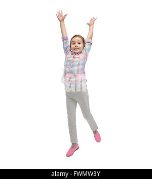 Happy little girl jumping in air Banque D'Images