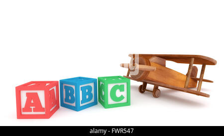 Avion jouet en bois et les blocs d'apprentissage isolé sur un fond blanc. Banque D'Images