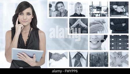 Composite image elegant brown haired model holding tablet Banque D'Images
