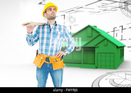 Composite image of worker carrying wooden planks Banque D'Images