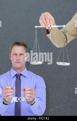 Composite image of young woman holding balance de la justice et un marteau Banque D'Images