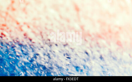 Photo floue d'une mousse sur le pare-brise dans un lavage de voiture, abstract background. Banque D'Images