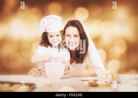 Image composite de portrait d'une adorable Mère et fille la préparation d'un ensemble daugh Banque D'Images