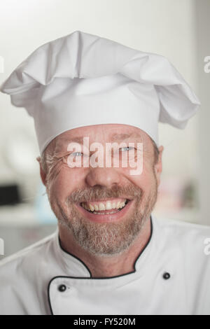 Faire cuire dans l'embout blanc rires Banque D'Images