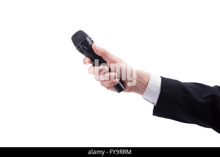 La main de l'homme avec un microphone sur un fond blanc. Banque D'Images