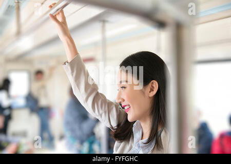 Businesswoman in subway Banque D'Images