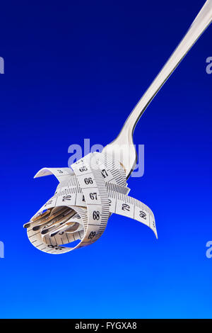 Fourche avec ruban de mesure, les régimes Obésité Concept Banque D'Images