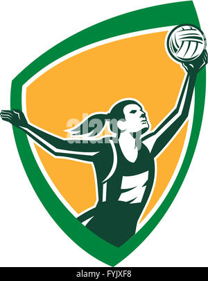 Le netball Player Catching Ball Shield Retro Banque D'Images