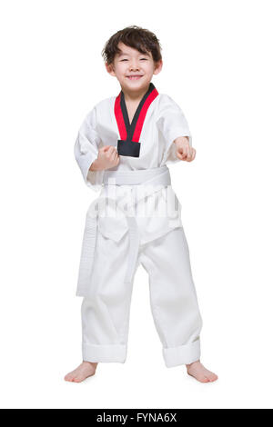 Cute boy pratiquer le Tae Kwon Do Banque D'Images