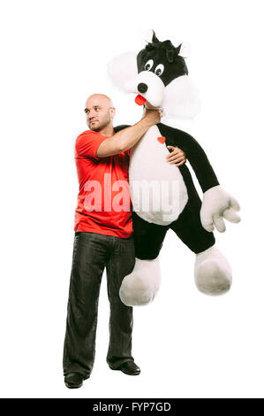Homme se dispute avec un jouet animal Banque D'Images