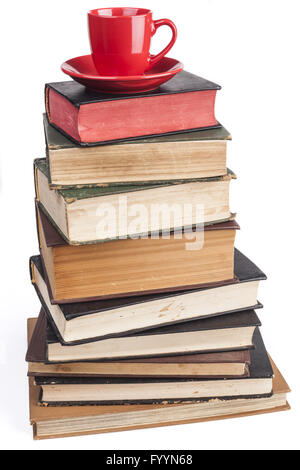 Mug rouge sur les livres Banque D'Images