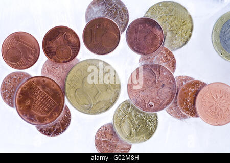 pièces de monnaie dans la glace Banque D'Images