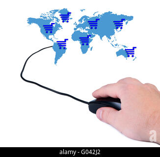 La main avec la souris de l'ordinateur et la carte du monde. Banque D'Images
