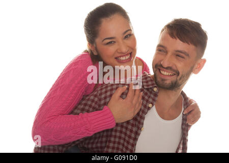 Happy woman riding piggyback sur l'ami Banque D'Images