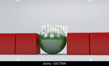 Sphère verte debout dans le concept cubes rouges Banque D'Images