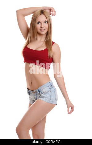 Jolie jeune femme en jeans shorts on white background Banque D'Images