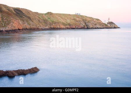 Phare Baily au coucher du soleil dans la péninsule de Howth, Dublin, Irlande Banque D'Images