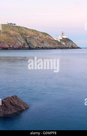 Phare Baily au coucher du soleil dans la péninsule de Howth, Dublin, Irlande Banque D'Images