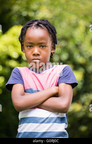 Angry boy with arms crossed Banque D'Images