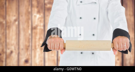 Composite image sur un chef holding a rolling pin Banque D'Images
