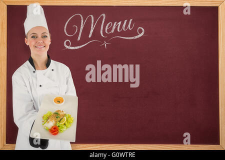 Image composite de femme chef smiling, un repas Banque D'Images