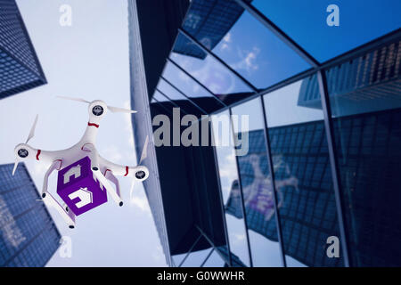 Image composite d'un bourdon portant un cube violet Banque D'Images