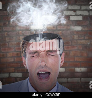 Composite image of businessman avoir un mal de tête Banque D'Images