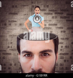 Image composite de furious classy businesswoman talking in megaphone Banque D'Images
