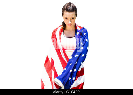 Portrait of sporty woman holding American flag Banque D'Images