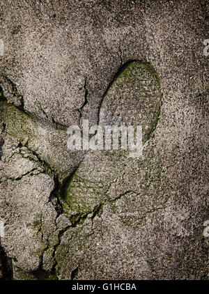 L'empreinte de chaussures sur une surface en béton, abstract background Banque D'Images