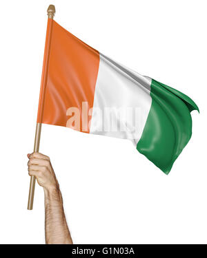 Brandissant fièrement à la main le drapeau national de la Côte d'Ivoire, 3D Rendering Banque D'Images