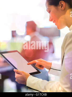Businesswoman using digital tablet in office Banque D'Images