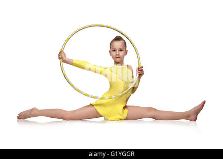 Petite fille faisant de la gymnastique avec cerceau, balle et - Stock photo  3042115