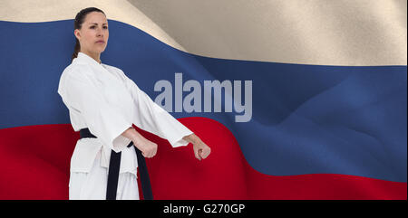 Image composite de la scène de chasse femelle position karaté Banque D'Images