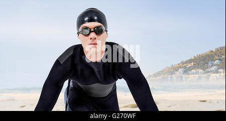 Composite image swimmer in wetsuit Banque D'Images