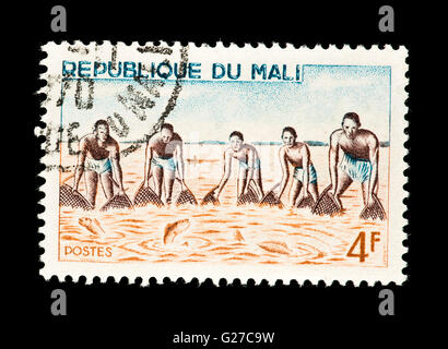 Timbre du Mali représentant des hommes autochtones à la pêche. Banque D'Images