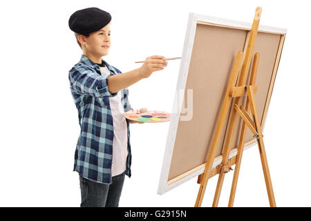 Petit enfant de peindre sur une toile avec un pinceau isolé sur fond blanc Banque D'Images