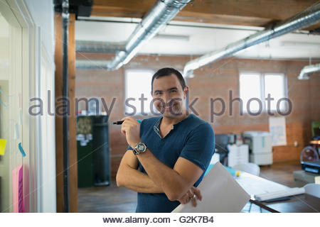 Portrait confiant creative businessman in office