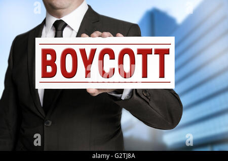 Bouclier de boycott est détenu par d'affaires. Banque D'Images