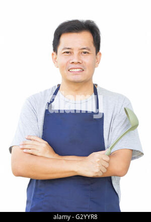 L'Homme asiatique contre son bras avec l'outil de cuisine Banque D'Images