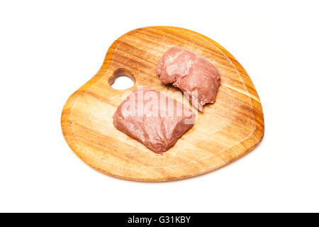 D'Autruche cuit (Struthio camelus) steaks de viande isolated on a white background studio. Banque D'Images