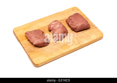 D'Autruche cuit (Struthio camelus) steaks de viande isolated on a white background studio. Banque D'Images