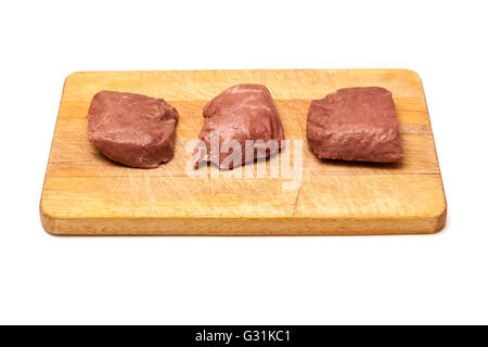 D'Autruche cuit (Struthio camelus) steaks de viande isolated on a white background studio. Banque D'Images