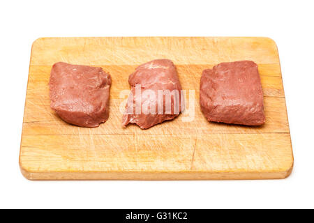 D'Autruche cuit (Struthio camelus) steaks de viande isolated on a white background studio. Banque D'Images