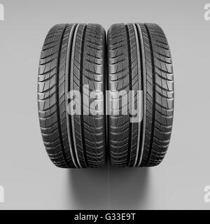 Deux nouveaux pneus auto close up sur fond blanc.  : Chemin de détourage. 3d illustration Banque D'Images