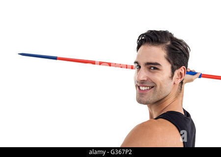 Portrait de l'athlète masculin heureux holding javelin Banque D'Images