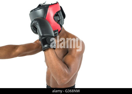 Vue latérale du boxeur frappant tout droit Banque D'Images