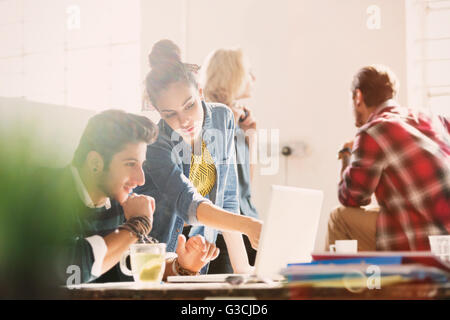 Creative young business people working at desk in office Banque D'Images