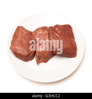 D'Autruche cuit (Struthio camelus) steaks de viande isolated on a white background studio. Banque D'Images